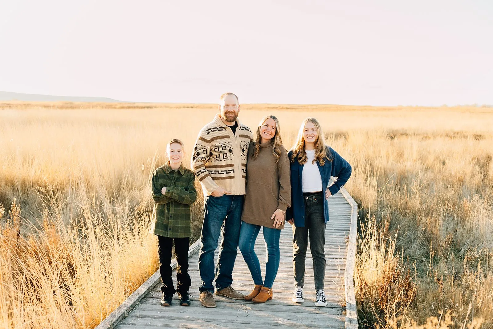 Amanda Francis and her family on a scenic boardwalk.