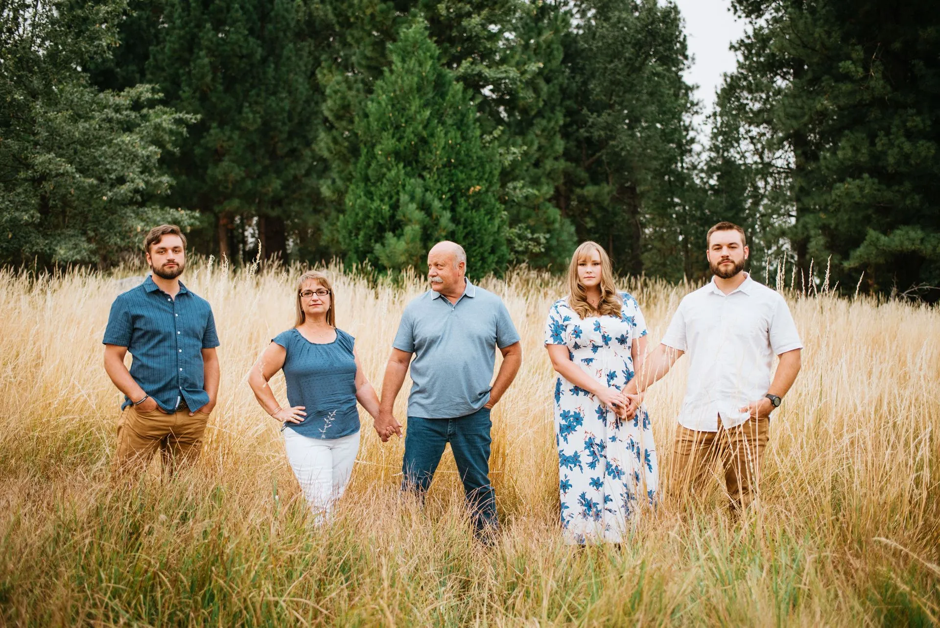 Renee Daggett in a family photo in a field.