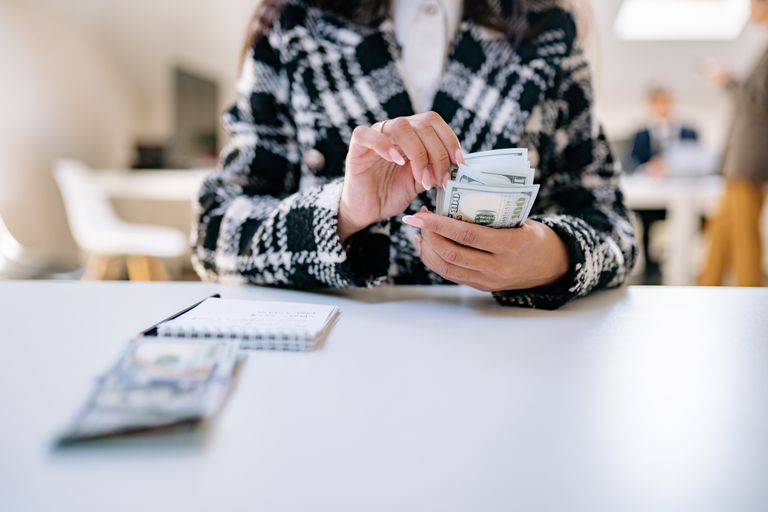 Business owner reviewing payroll numbers to determine a reasonable S-corp salary